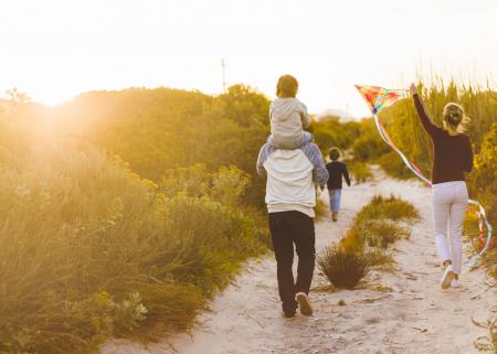 Family walking on a beach