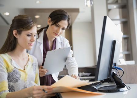 Medical professional explains information to woman