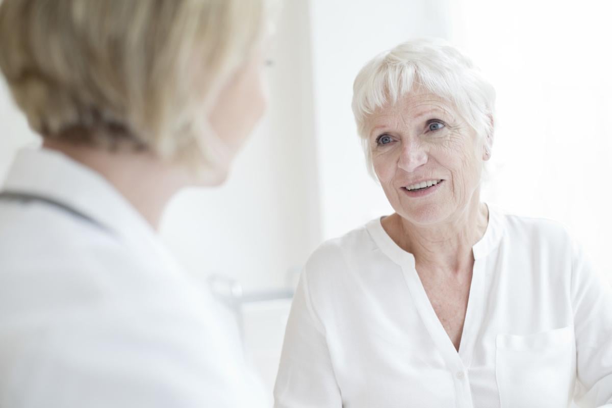 An older woman speaking with a physician