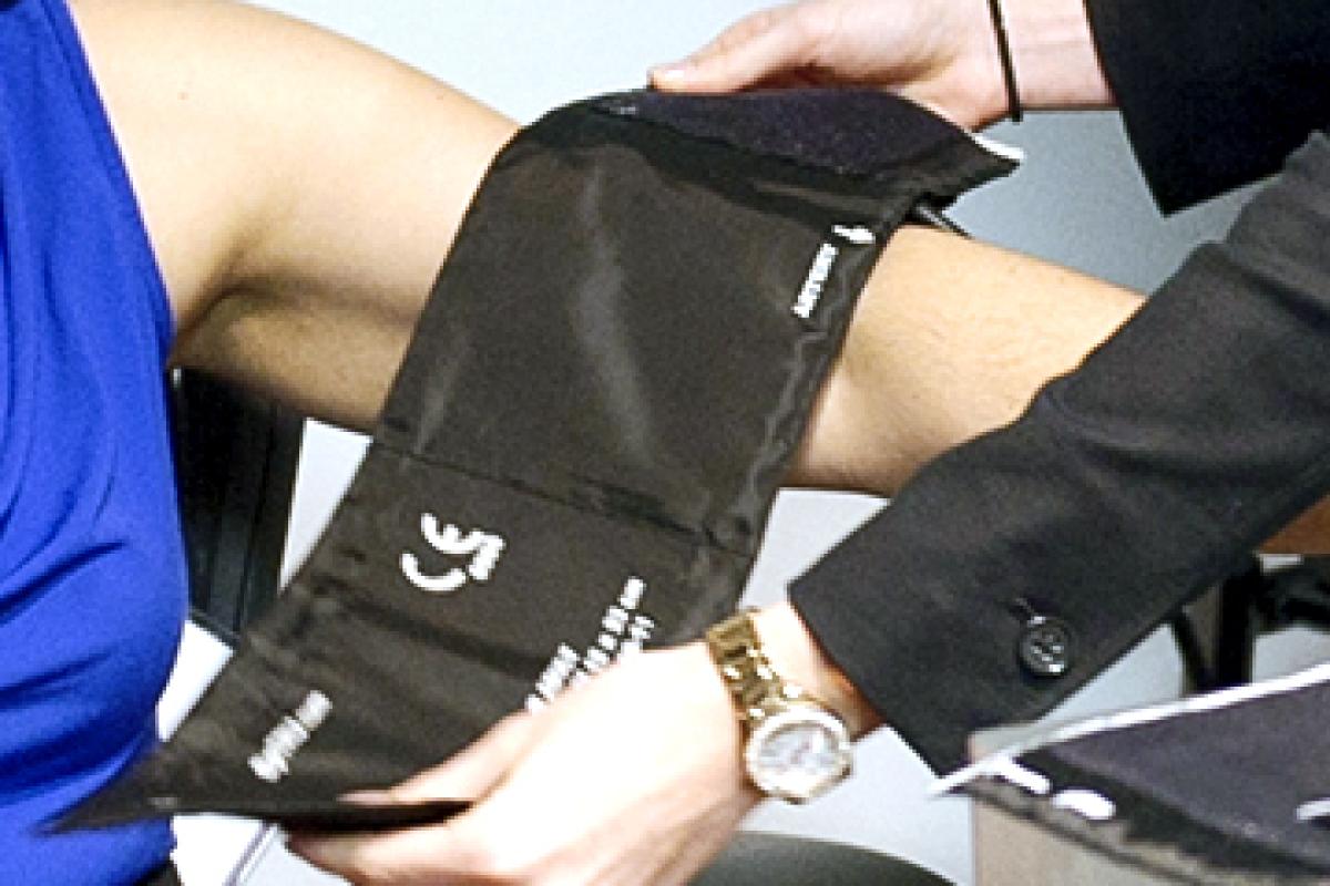 Physician taking a patient's blood pressure