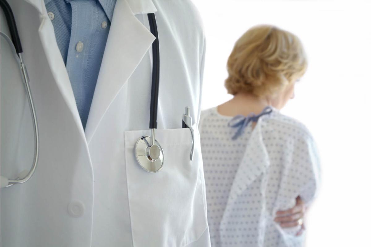 Physician with breast cancer patient