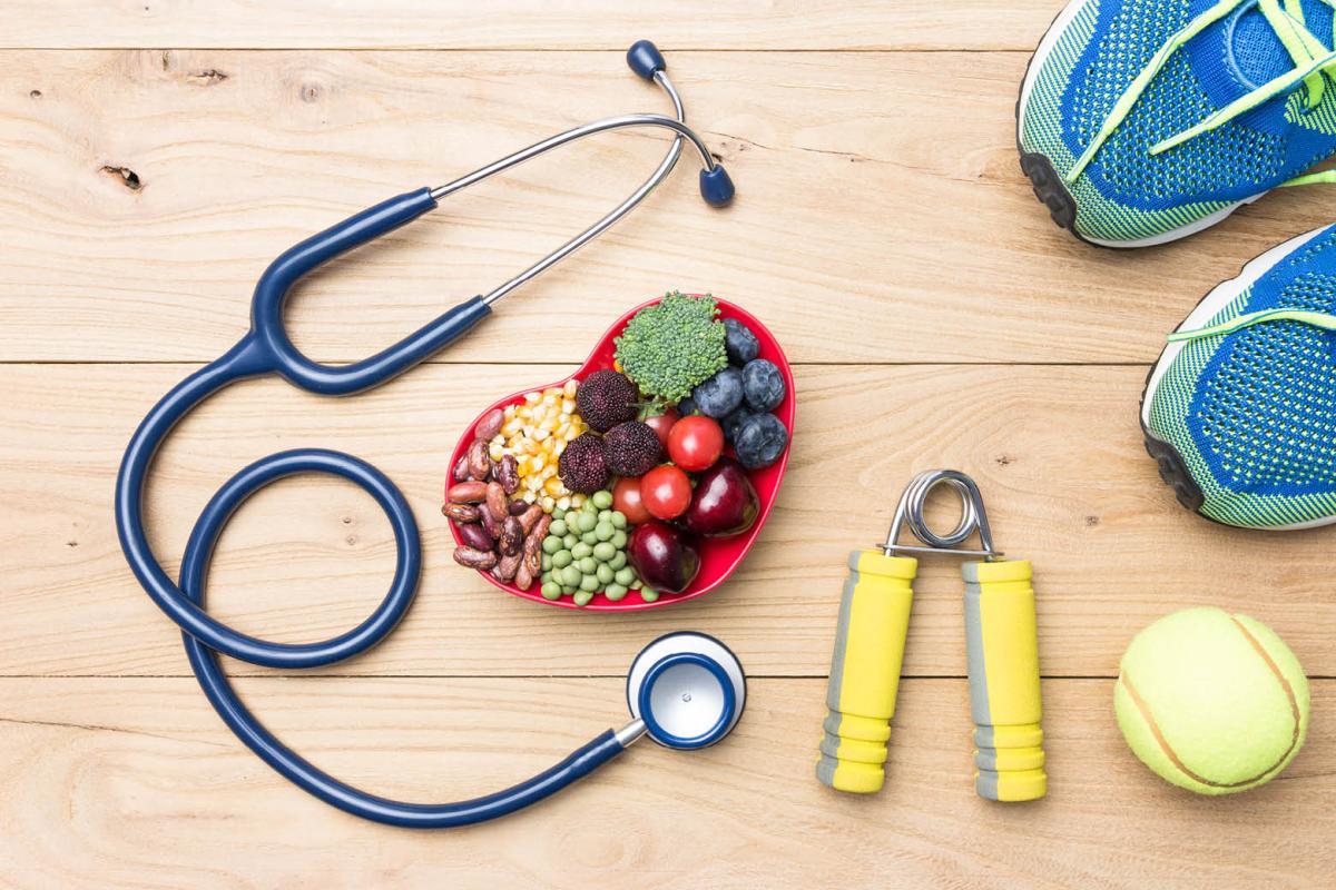 Stethoscope, healthy food and exercise gear