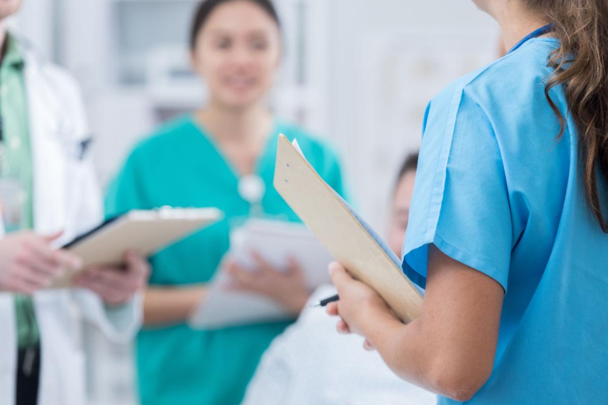 Group conversation with people in scrubs