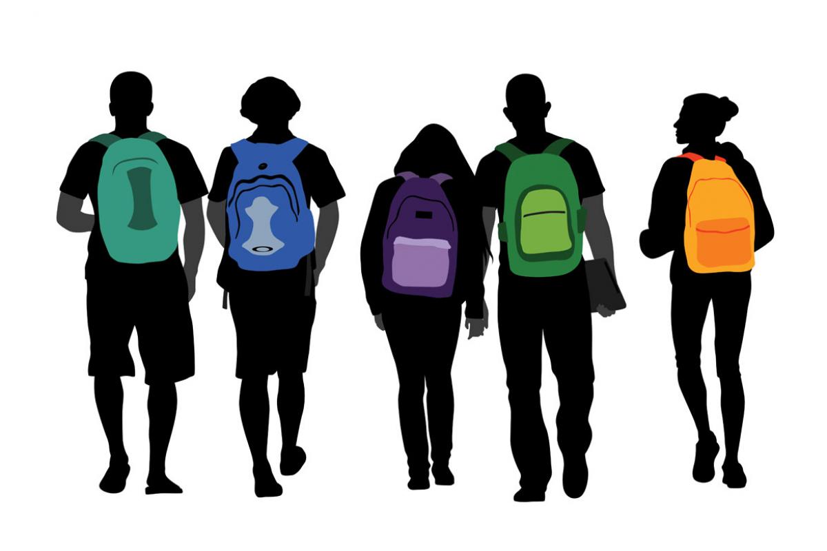 Students with colorful backpacks walking in a group