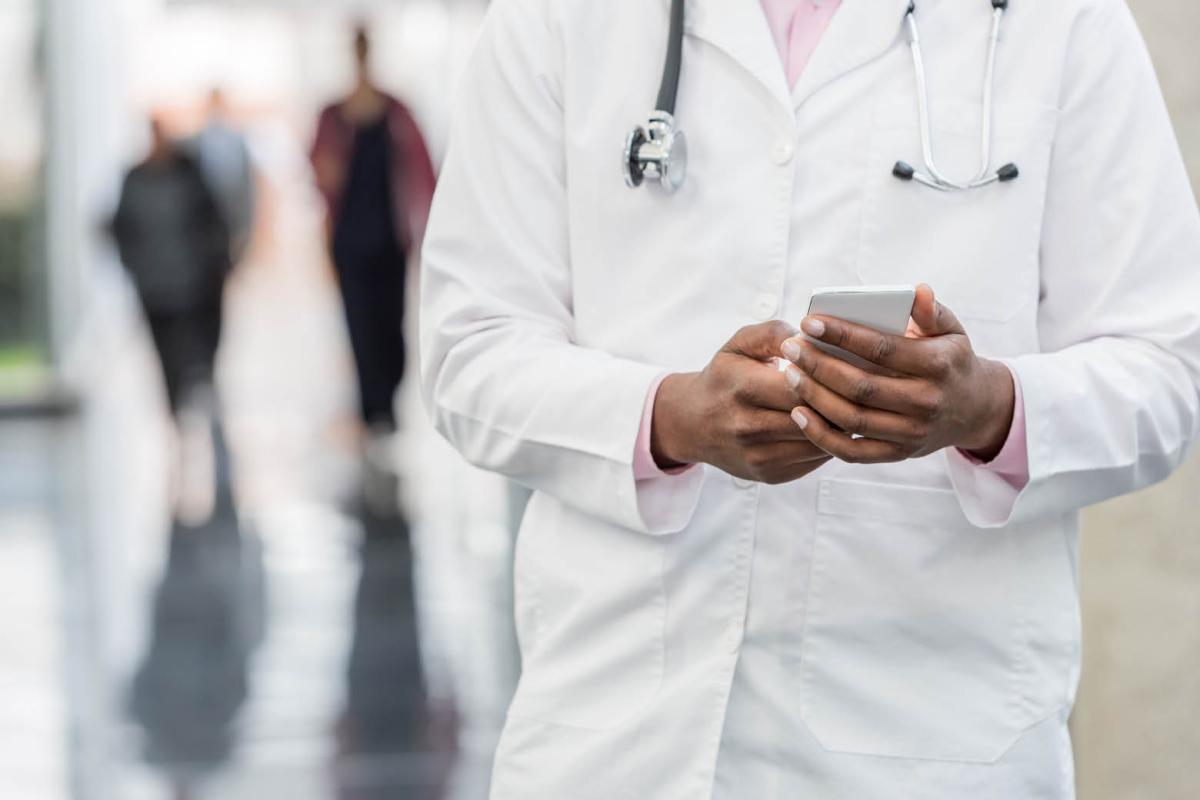Physician holding a smartphone