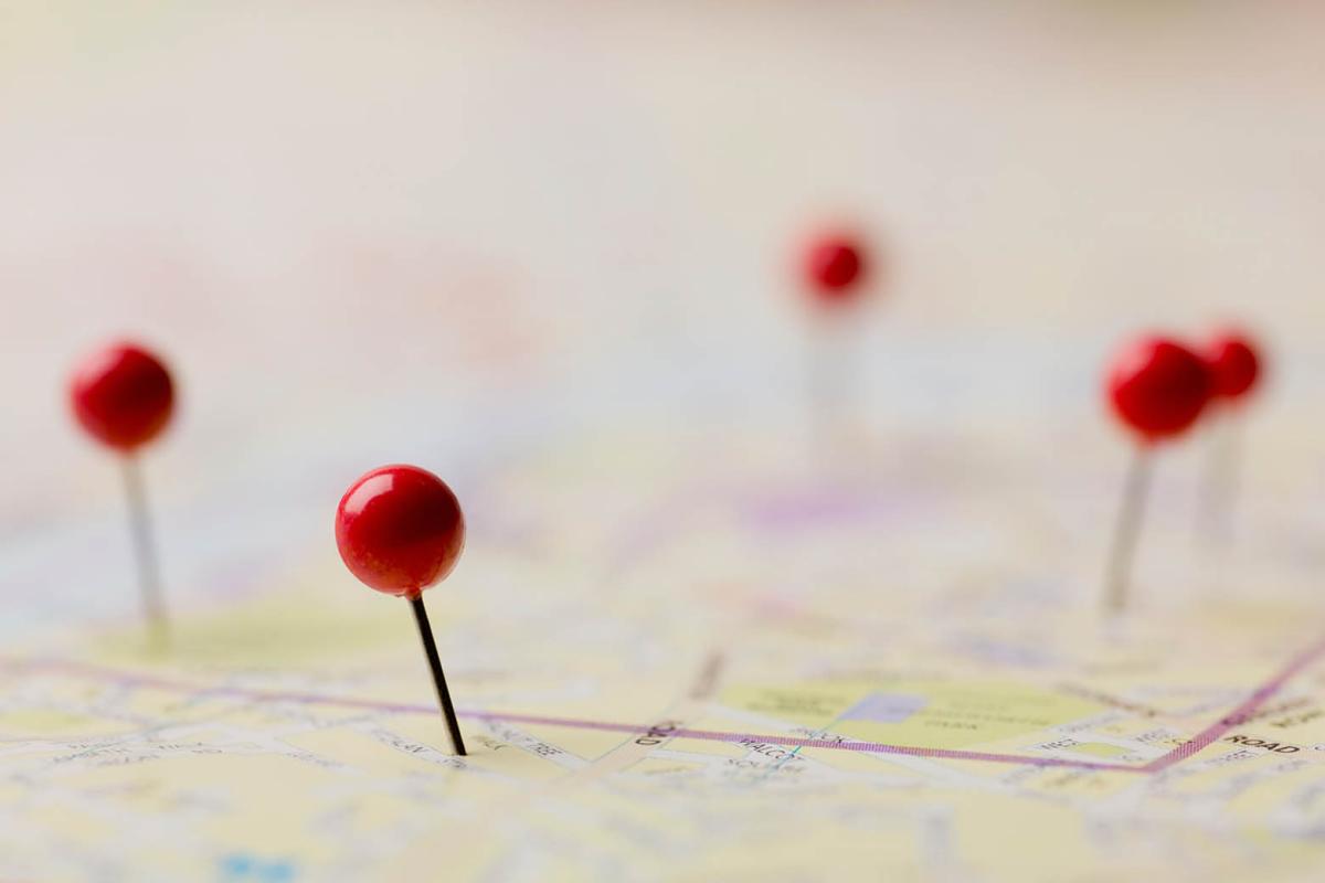 Push pins on a map
