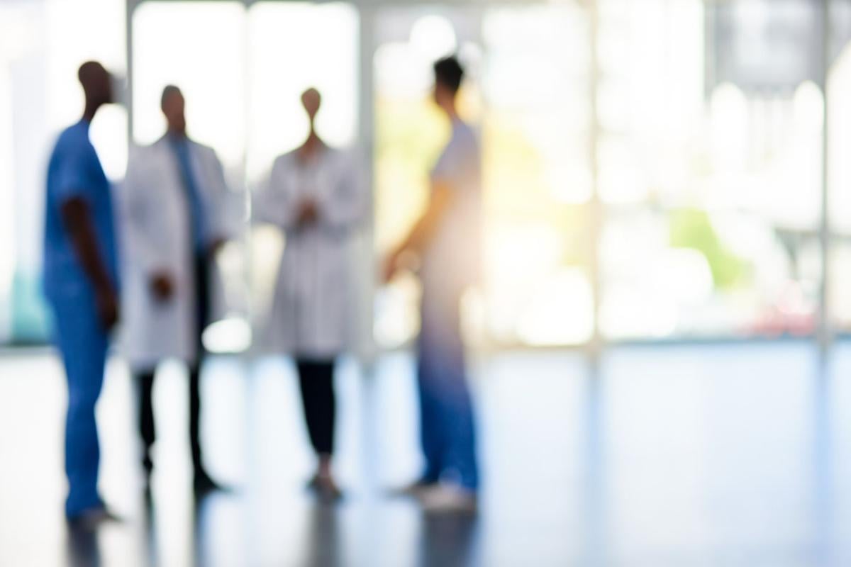 Blurred image of a group of physicians standing together