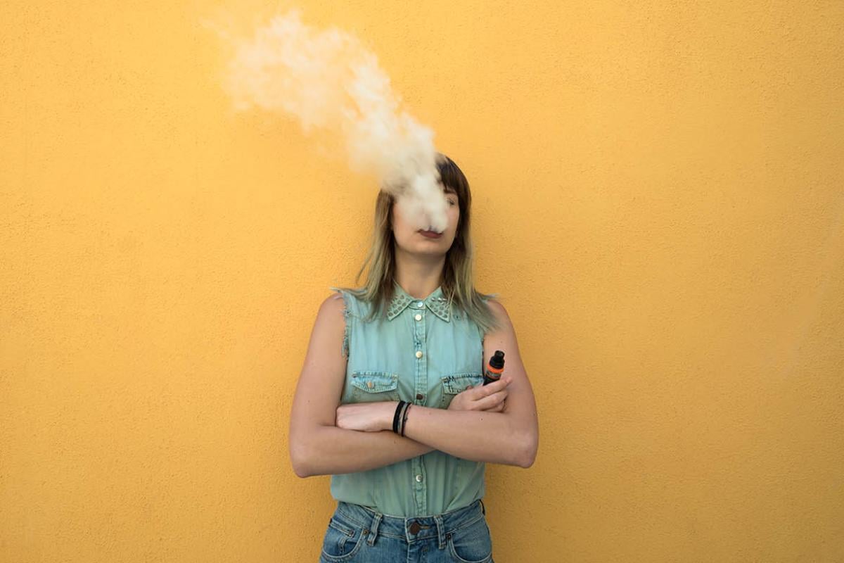 Woman smoking an e-cigarette