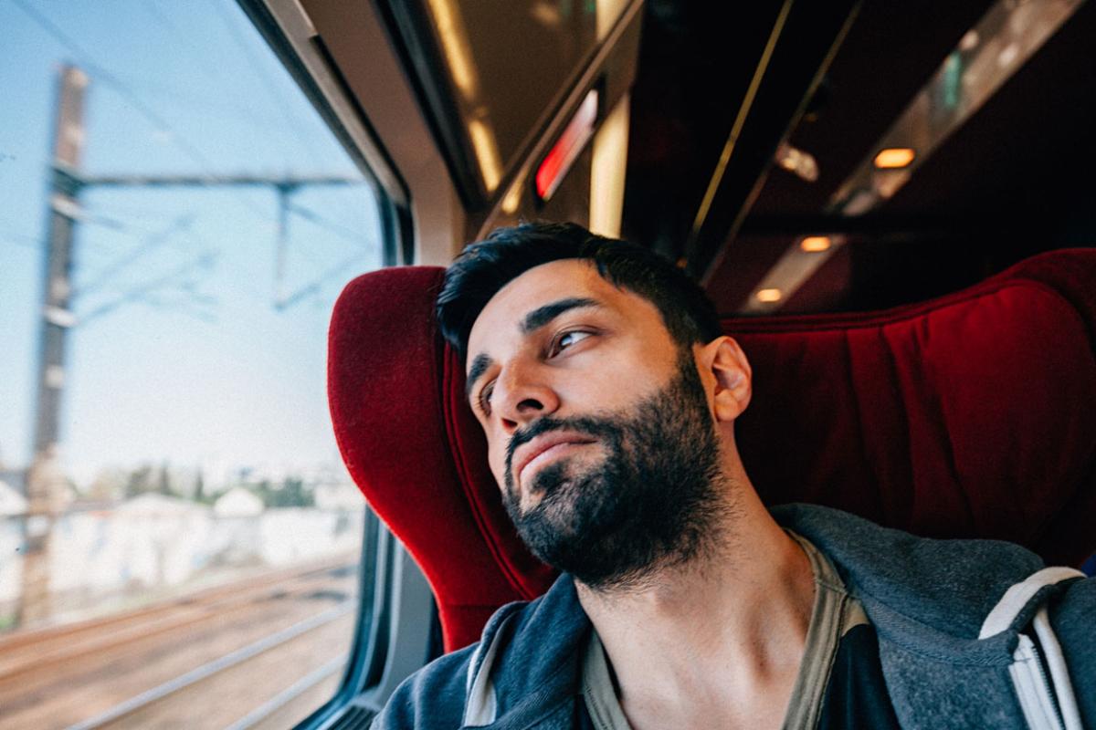 Man looking out of a train window