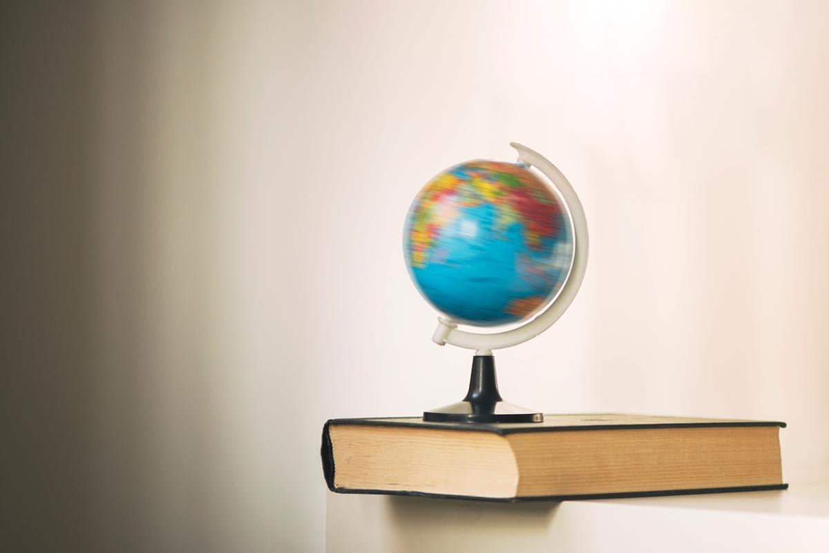 Spinning globe on a book