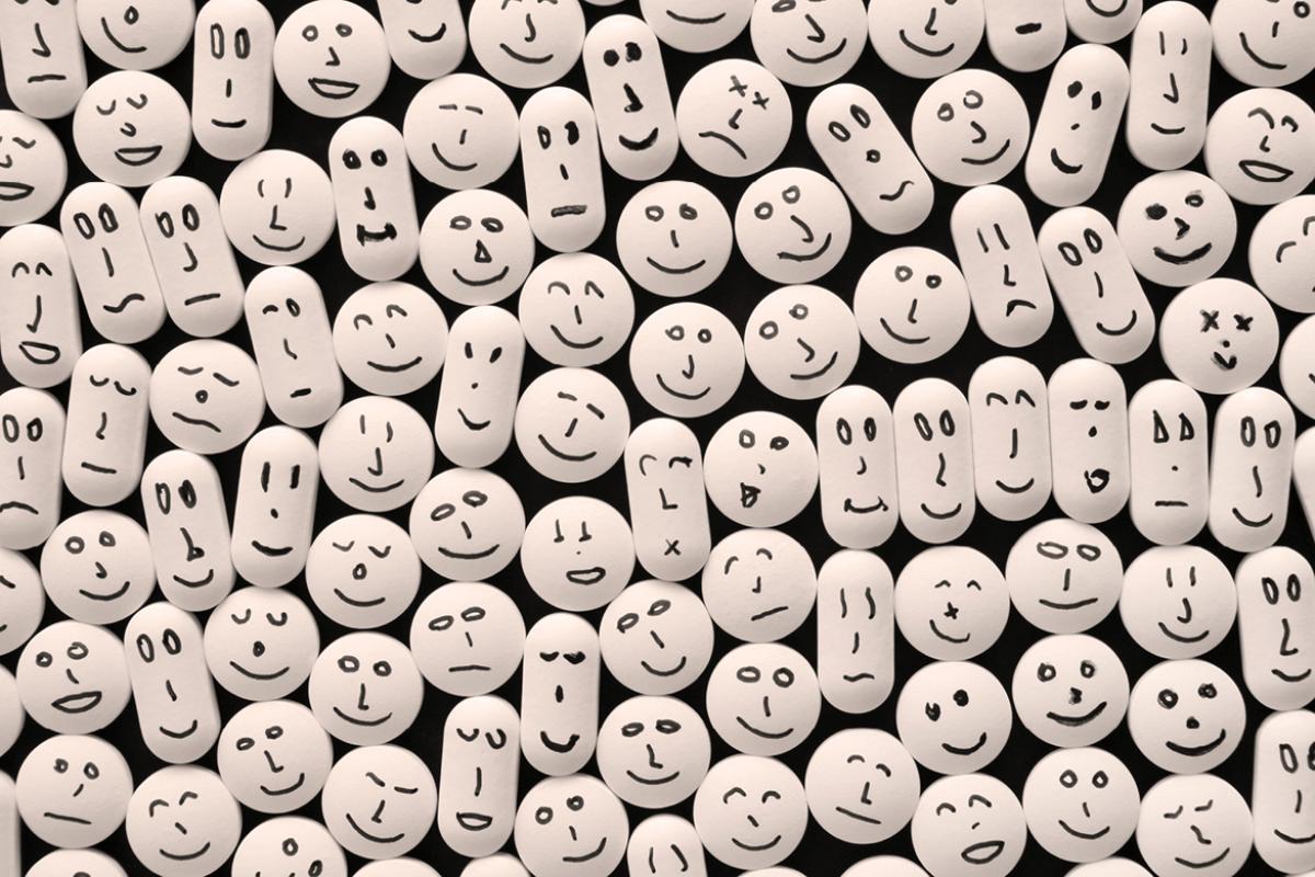 Pills with drawn smiling faces