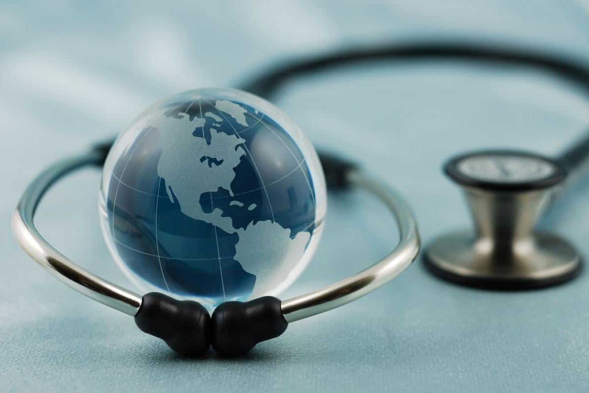 Image of stethoscope around a globe