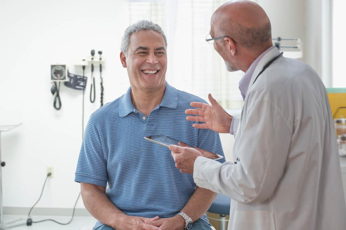 Smiling patient with physician