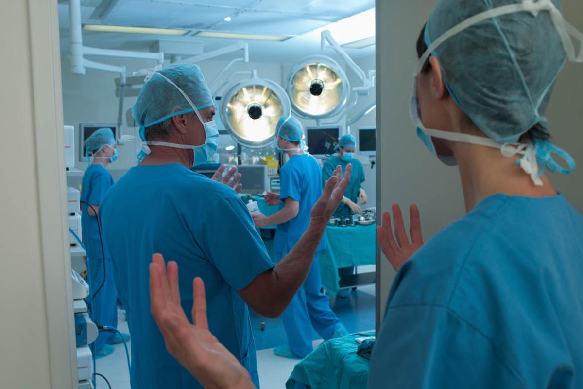 Physicians entering surgical room