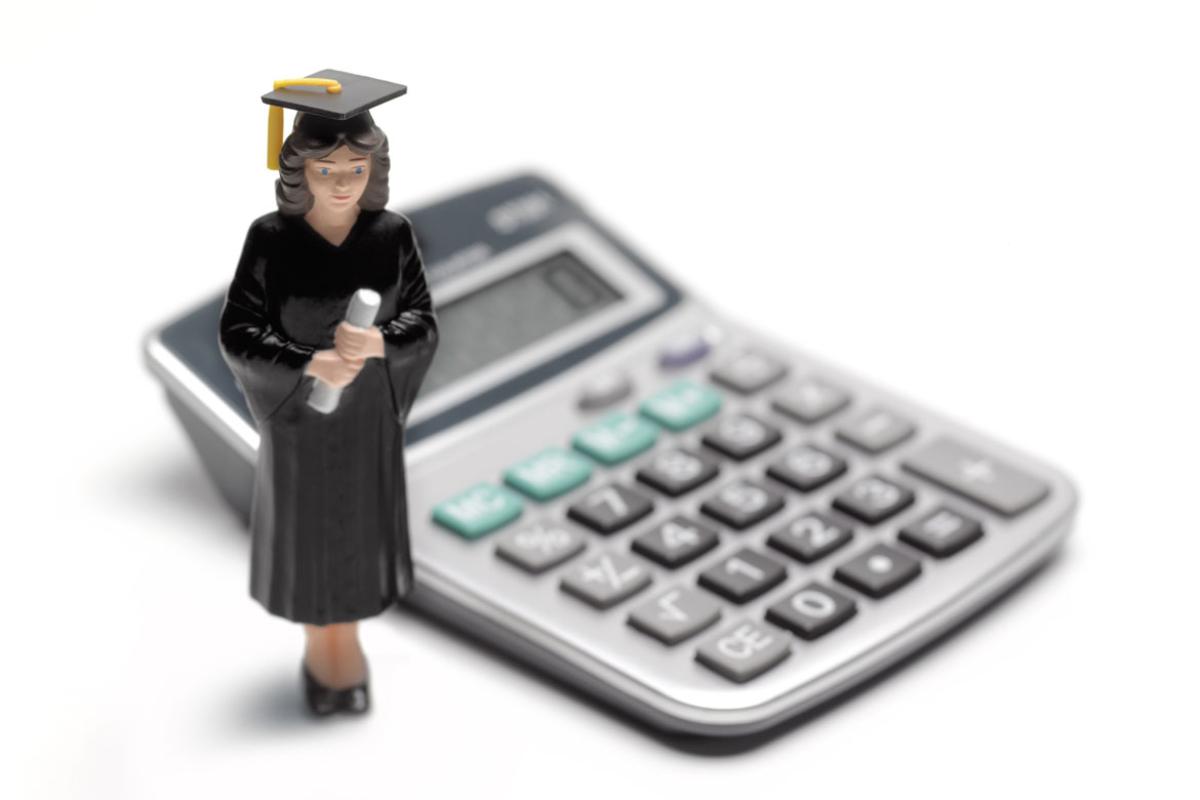 Graphic of a graduate in front of a calculator