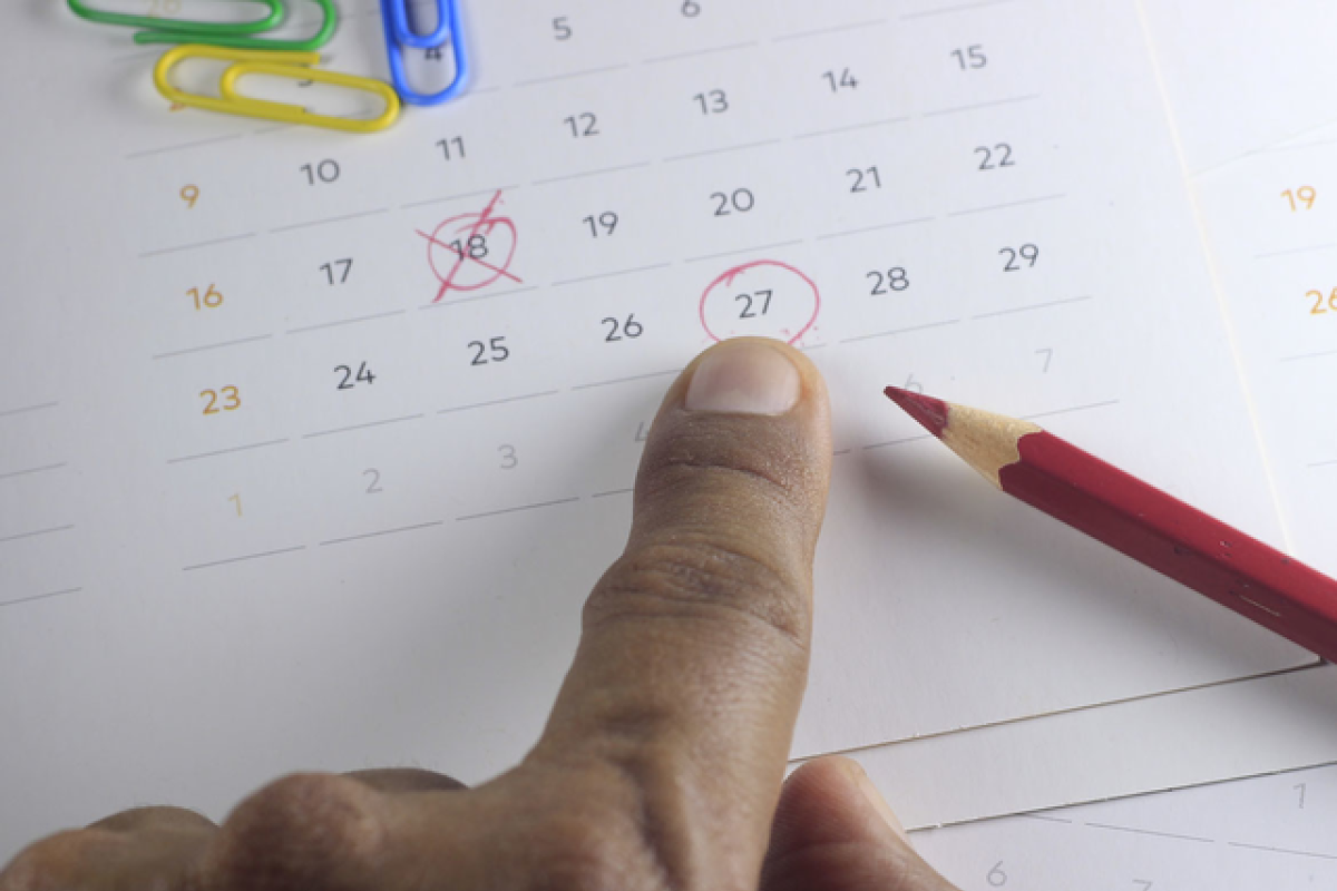Dates circled on a paper calendar