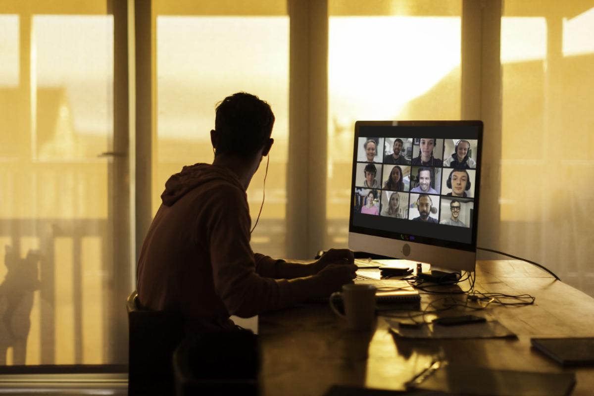 Person having a virtual meeting on a desktop