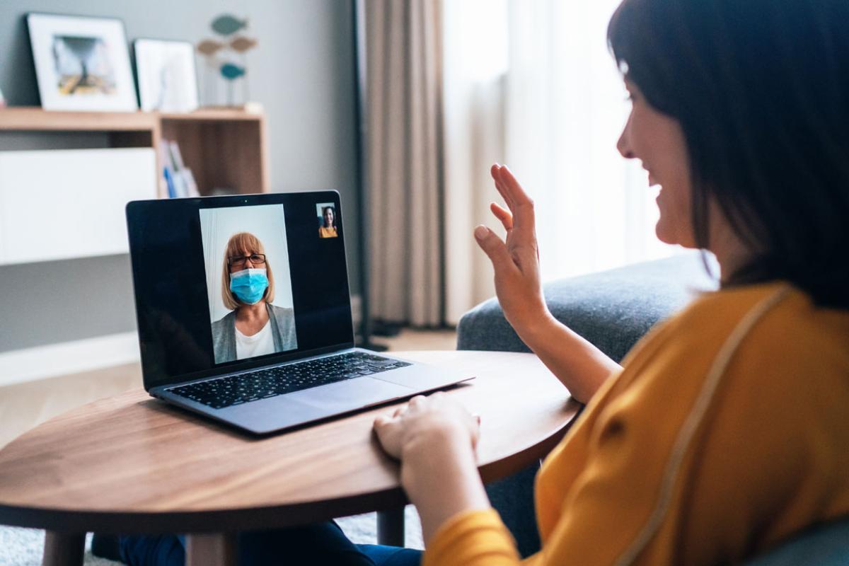 Patient consulting with a physician via webcam