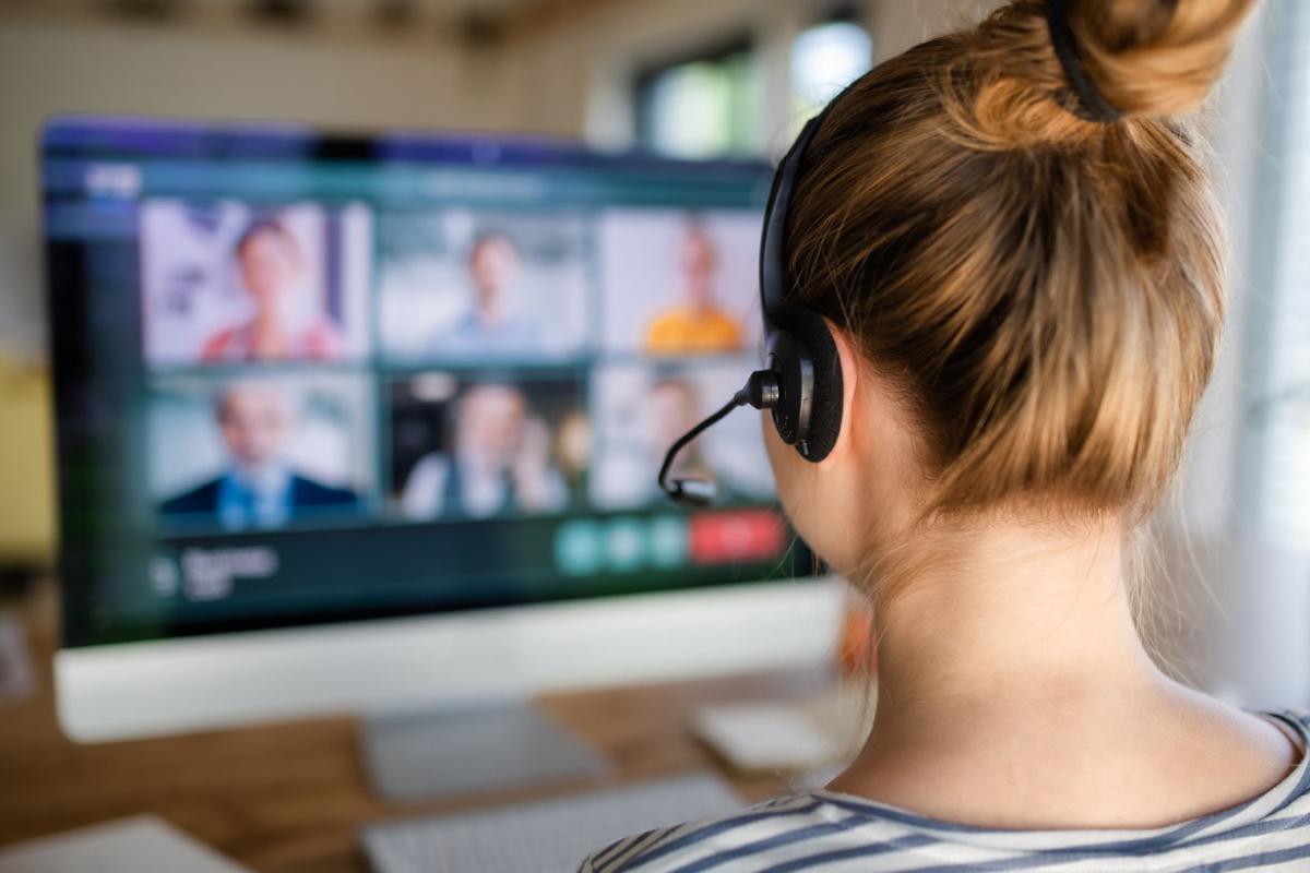 Person at a computer having a virtual meeting