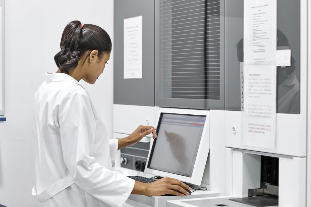 Health care worker using an in-exam room computer