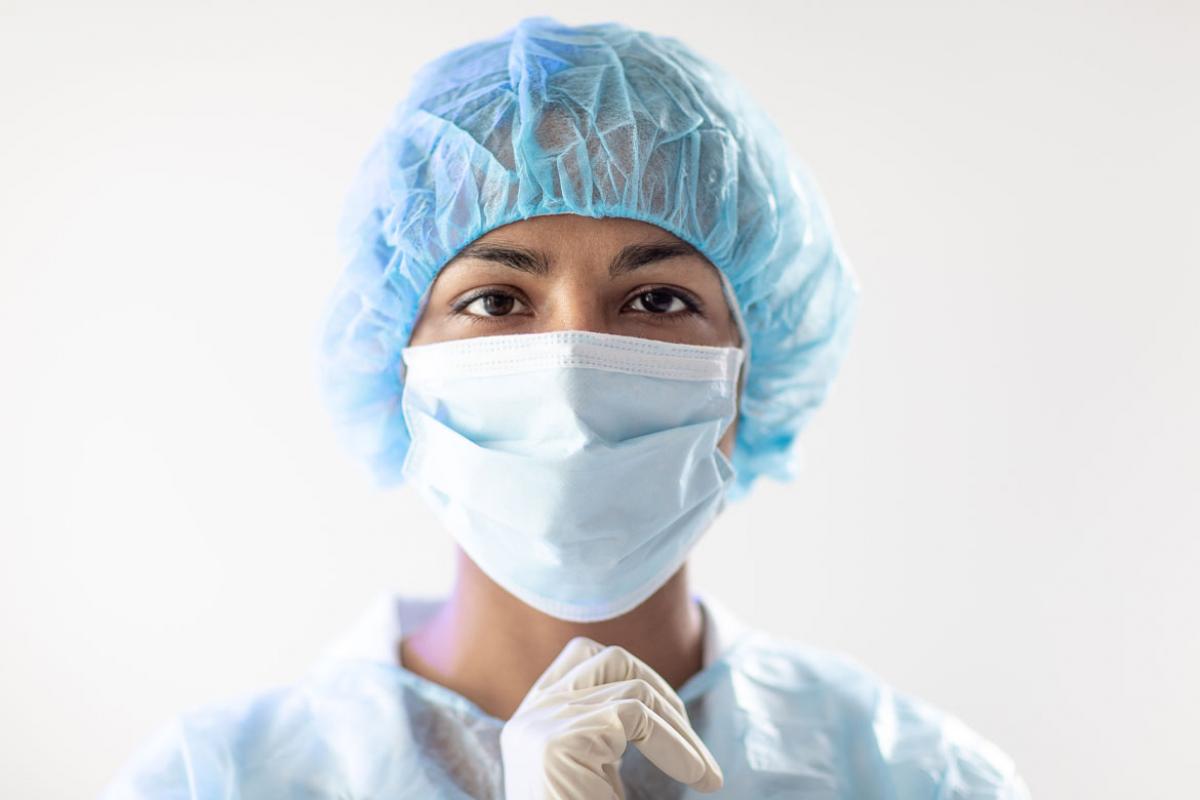Health care professional wearing a face mask.
