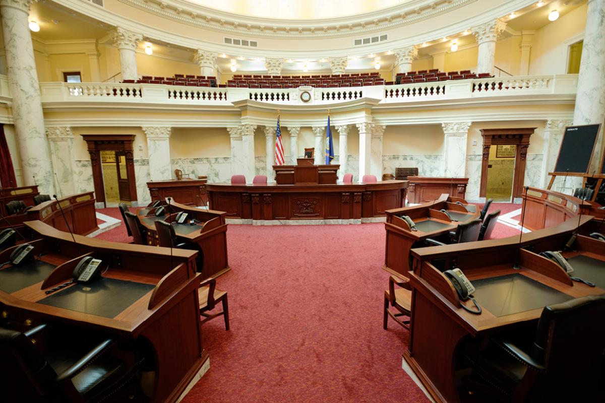 Legislature room showing podium and desks