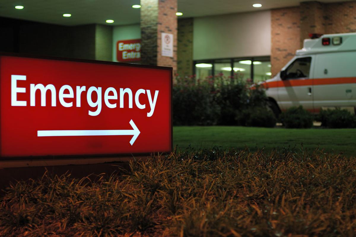 Outside an emergency room at night.