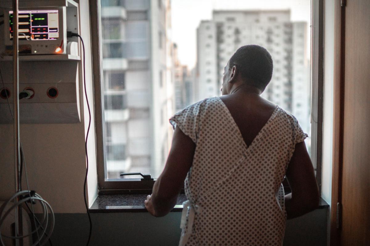 Person in hospital room looking out the window