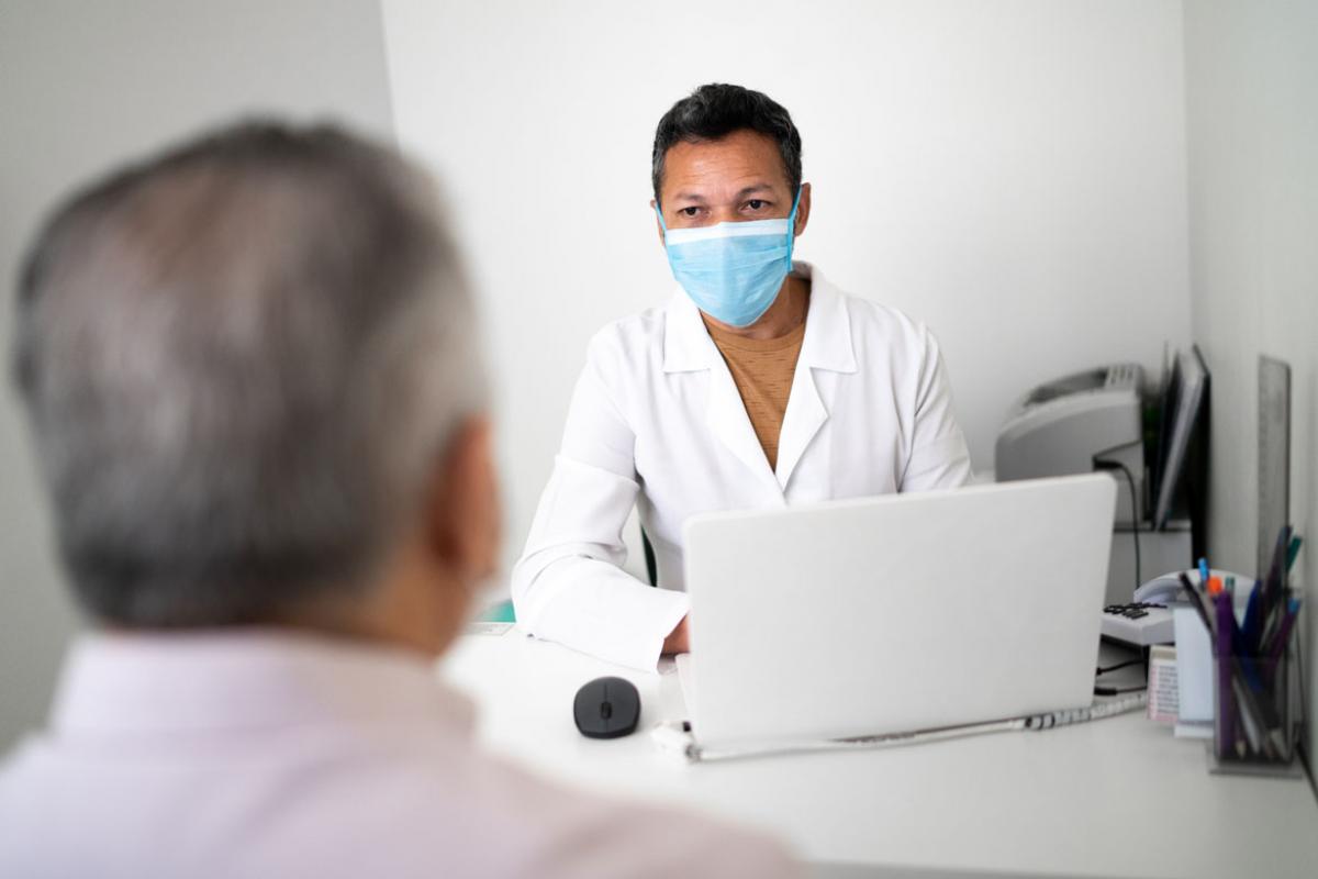 Physician wearing a face mask