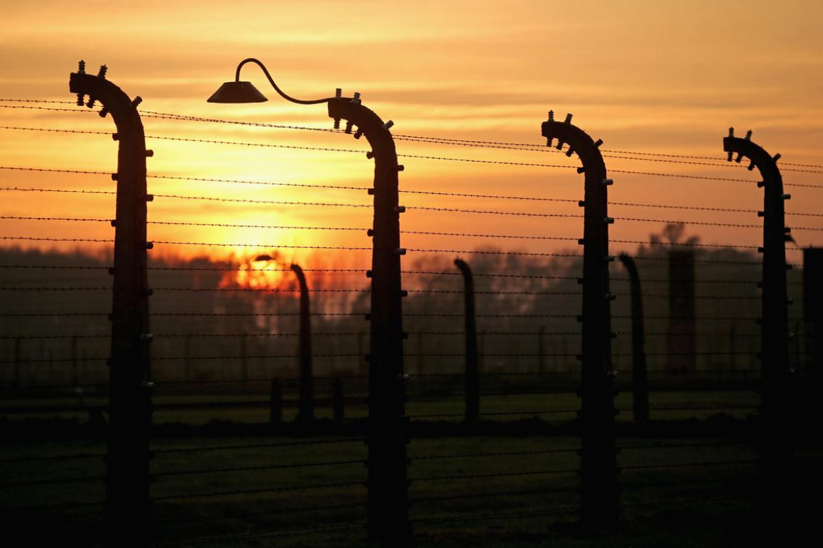 Sun rises over electrified fence