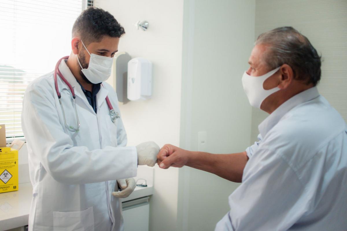 Patient and physician fist bump