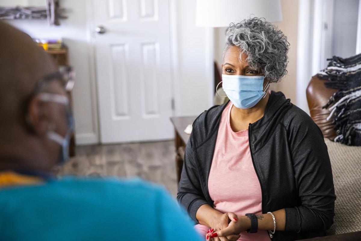 Patient speaking with a health care worker
