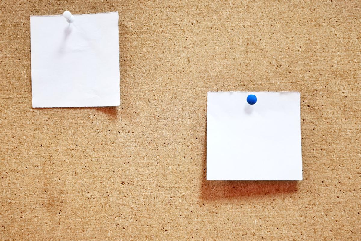 Note paper pinned to corkboard