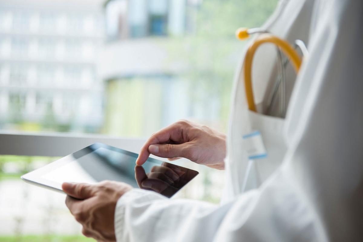 A physician using a smartpad.
