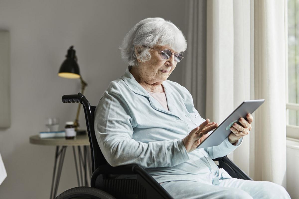 Elderly person using a tablet