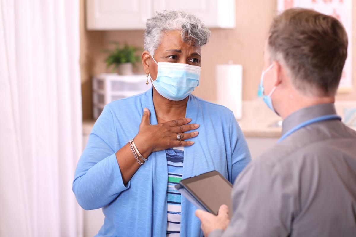 Patient speaking with health care worker