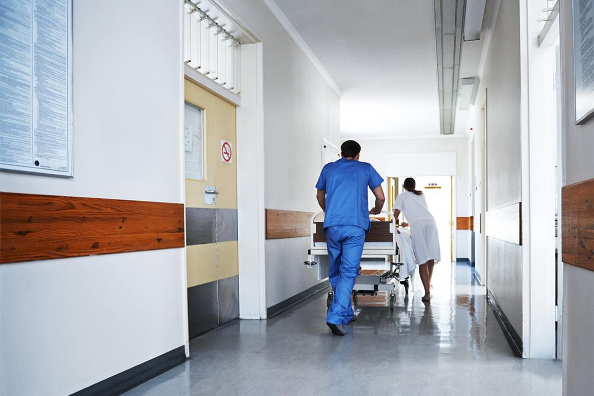 Health care workers in hospital hallway