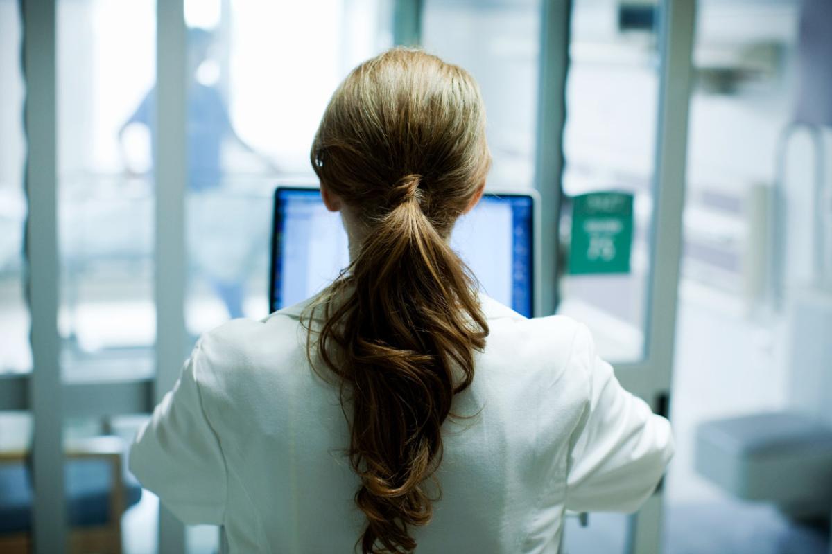 Health care worker at computer