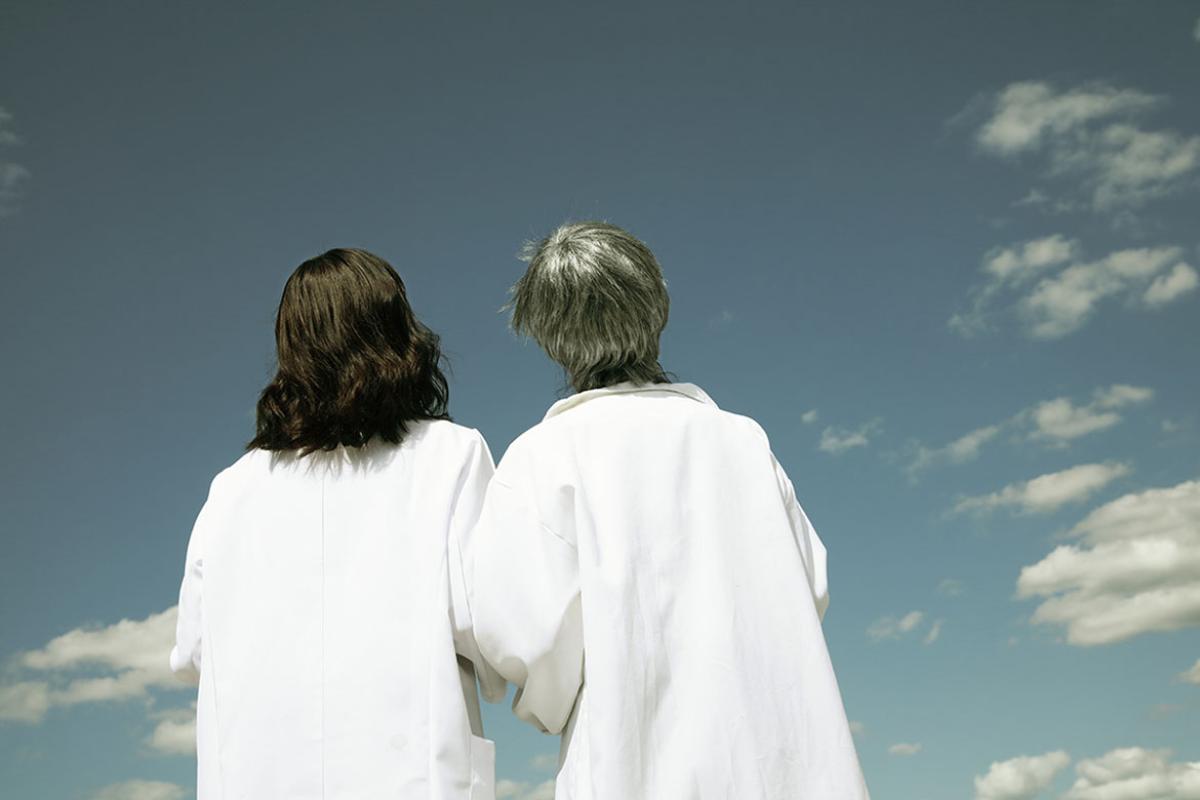  Two physicians looking up to the sky