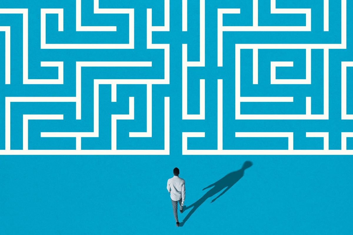 Overhead shot of a person about to walk into a maze