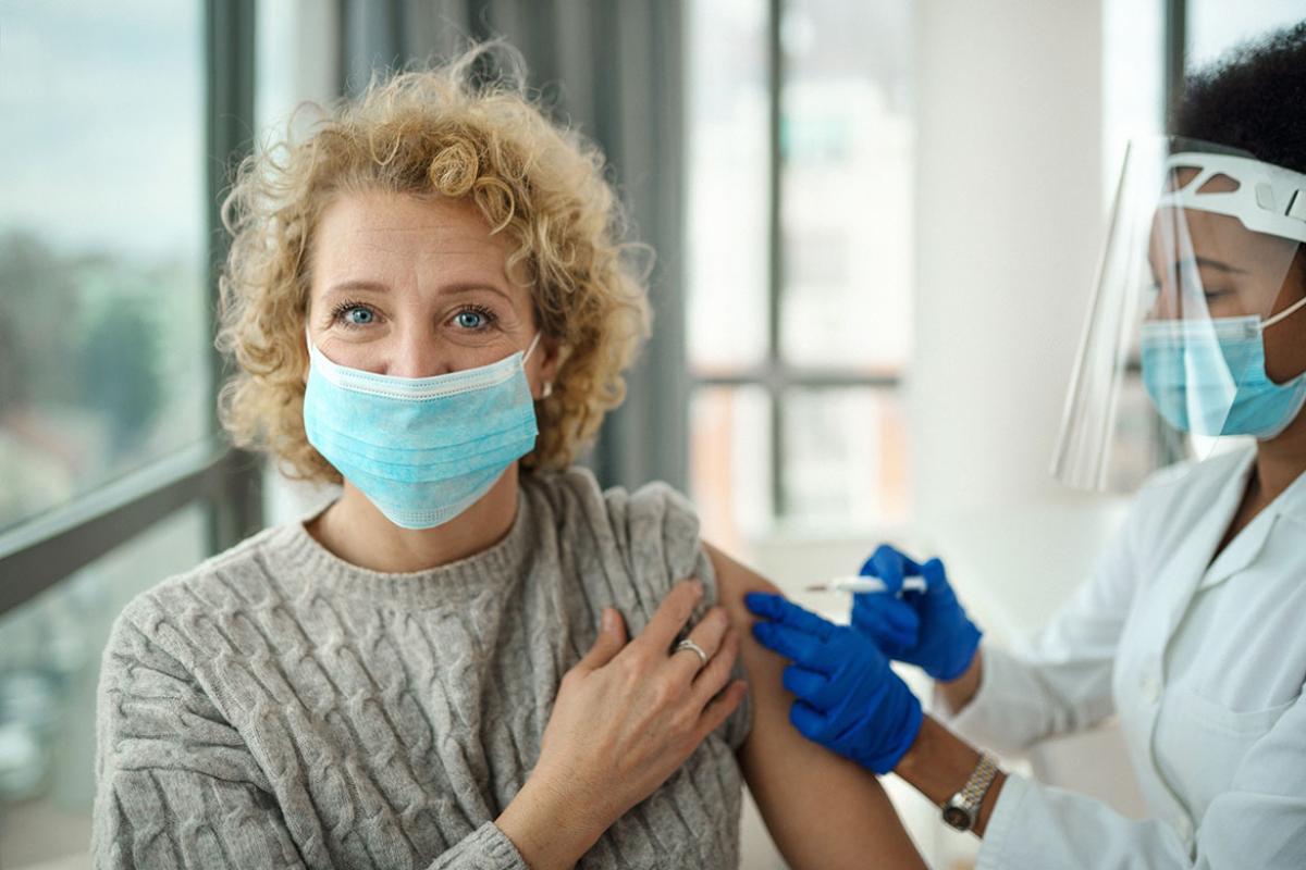 Person receiving a booster shot