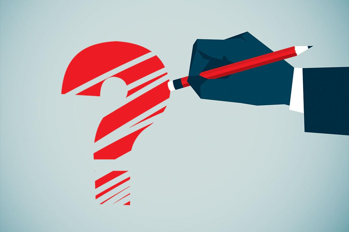 Hand erasing a question mark