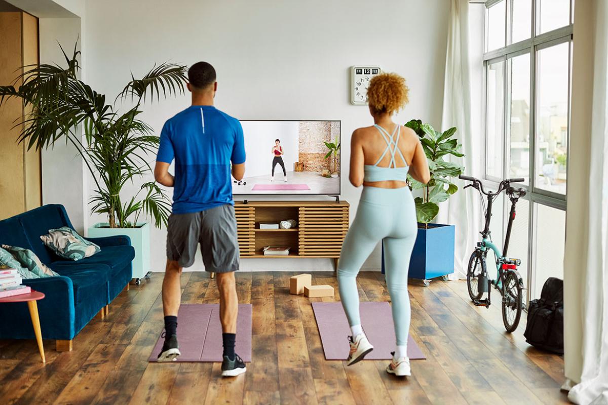 Two people working out at home
