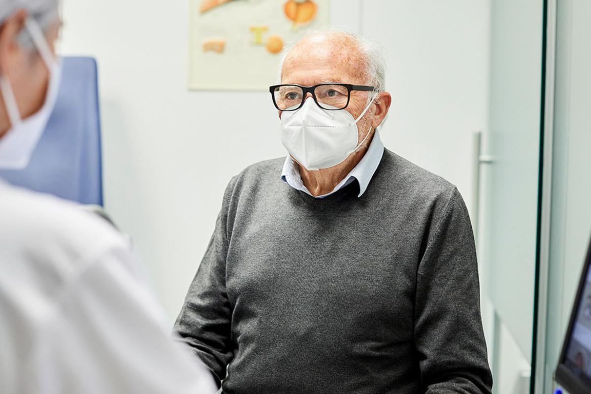 Elderly male patient wearing a mask