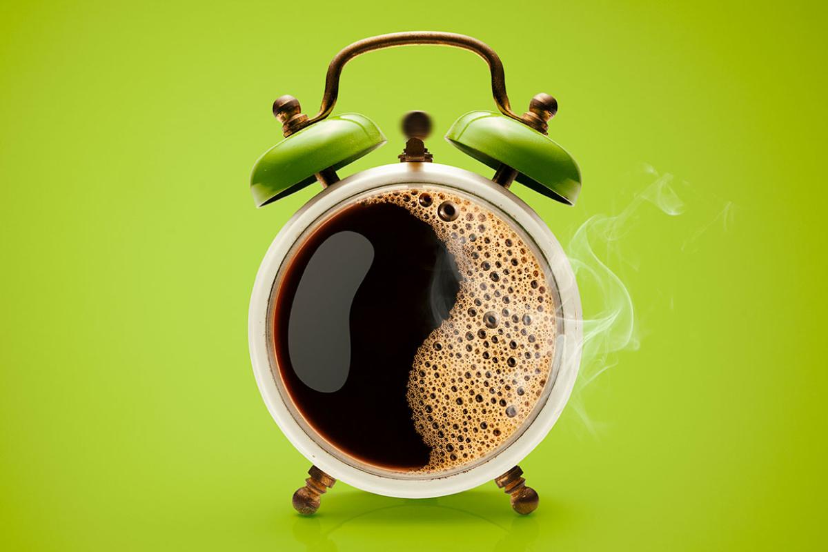 Alarm clock with a cup of coffee as the clock face