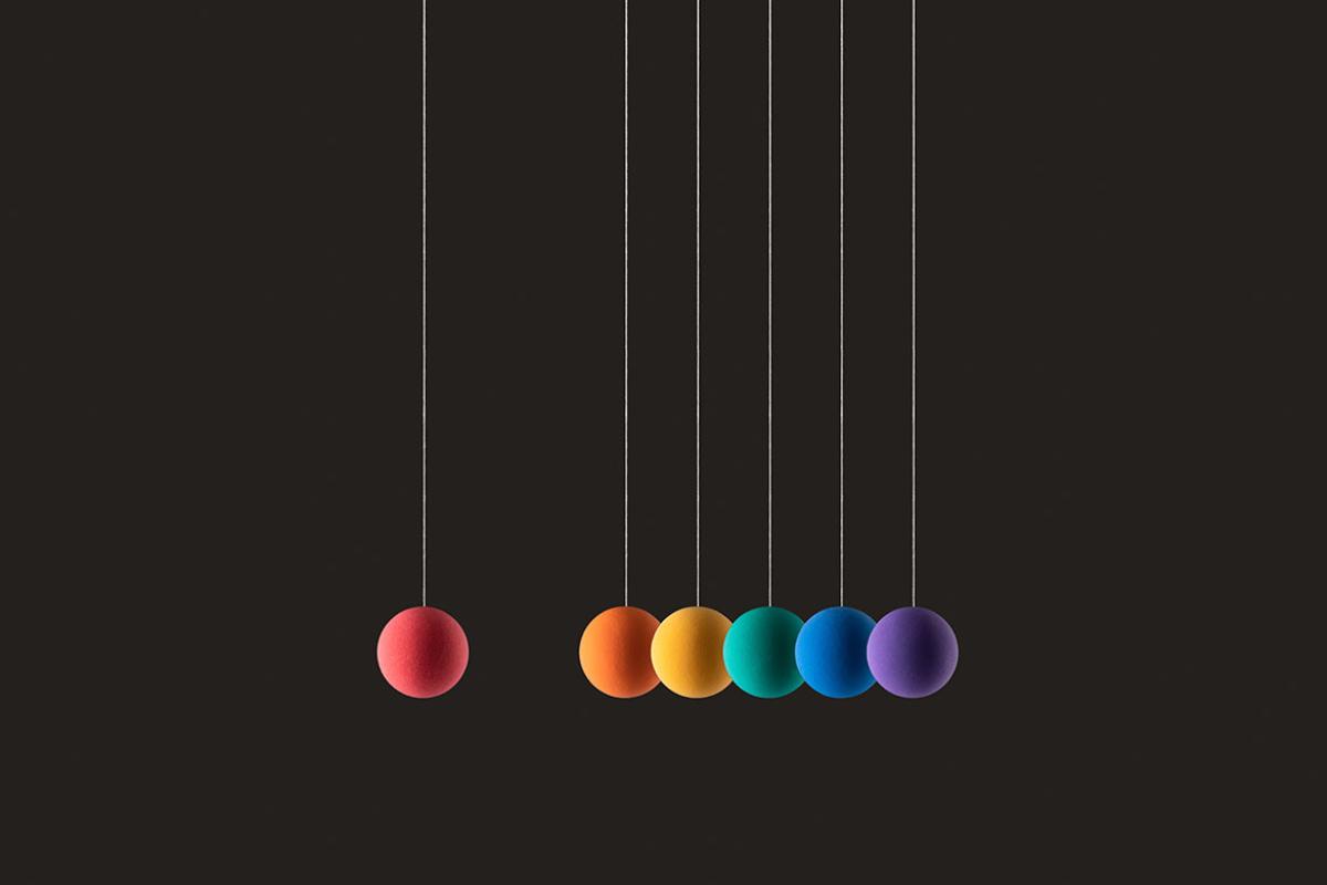 Spheres hanging on strings in a row