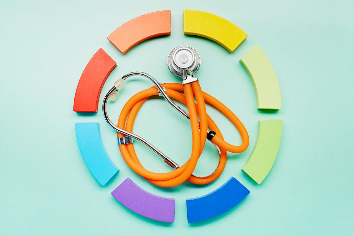 View of a pie chart made of building blocks and stethoscope