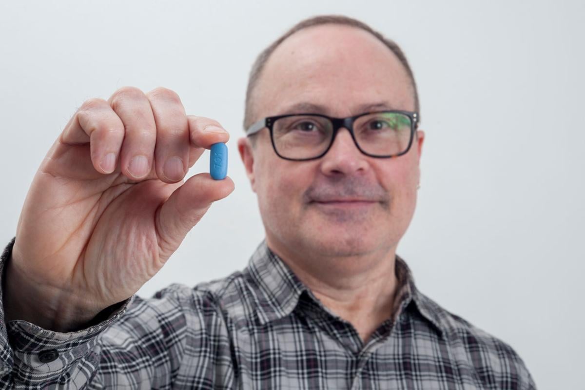 Person holding a PrEP pre-exposure prophylaxis HIV prevention Truvada pill