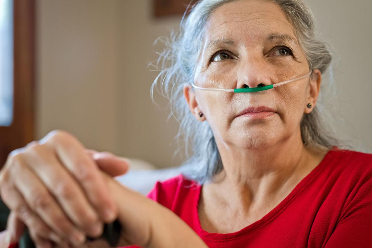Senior patient receiving oxygen