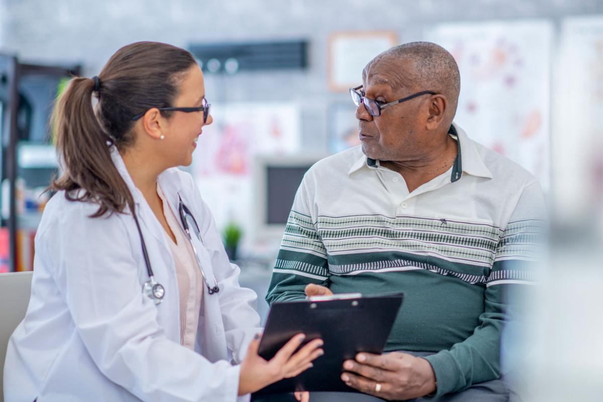 Physician and patient reviewing health record
